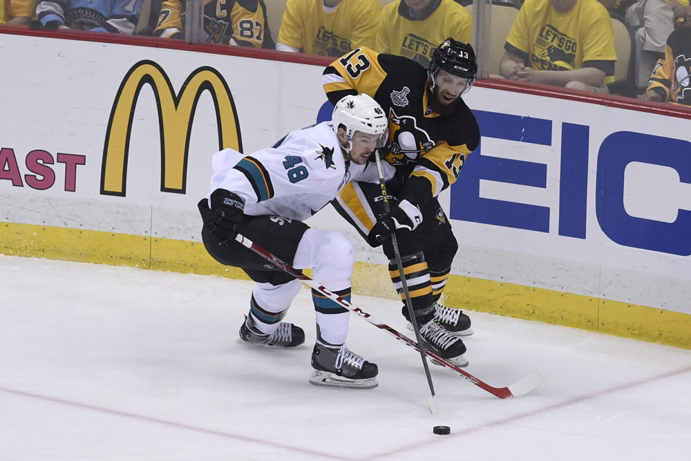 1 June 2016 Pittsburgh Penguins center Nick Bonino and San Jose Sharks center Tomas Hertl battle for the puck during the second period. Game Two was won 2-1 in overtime by the Pittsburgh Penguins against the San Jose Sharks in the 2016 NHL Stan