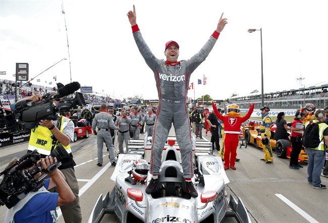 Will Power celebrates after winning race two of the Indy Car Detroit Grand Prix auto racing double header on Belle Isle in Detroit Sunday