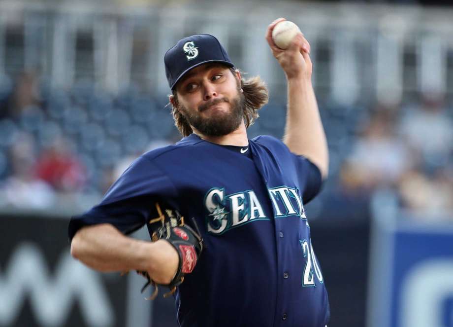 Seattle Mariners starting pitcher Wade Miley throws against the San Diego Padres during the first inning of a baseball game Thursday