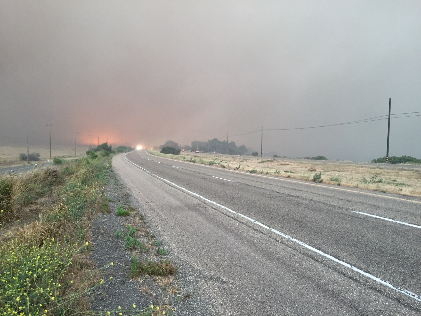 Smoke and flames moved closer to Highway 101 again Thursday night prompting the highway's closure