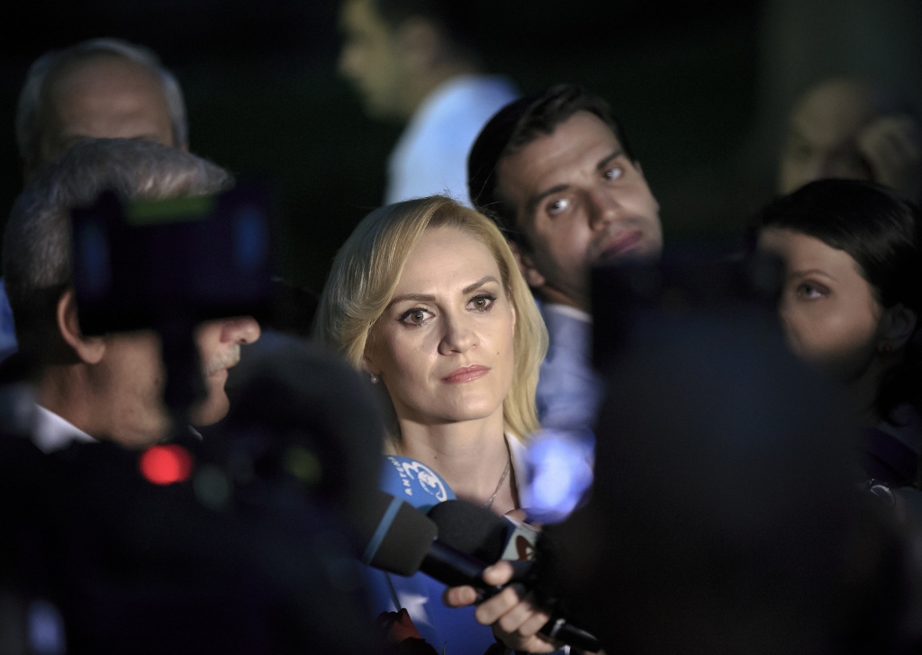 Gabriele Firea center is surrounded by media after the press statement that followed the release of exit polls in the local elections indicating she's the new mayor of the Romanian capital in Bucharest Romania Sunday