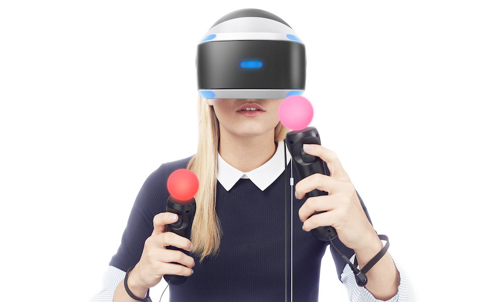 Woman wearing Sony Play Station VR Headset with Move Controllers