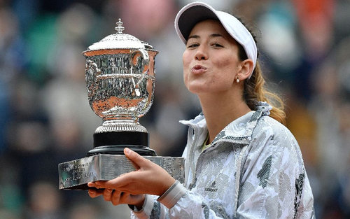 Spain's Garbine Muguruza wins her first Grand Slam title at the French Open