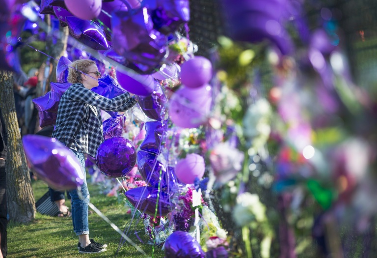 Getty  AFP  File  Scott OlsonA fan is seen visiting a memorial created outside Paisley Park the home and studio of Prince in Chanhassen Minnesota