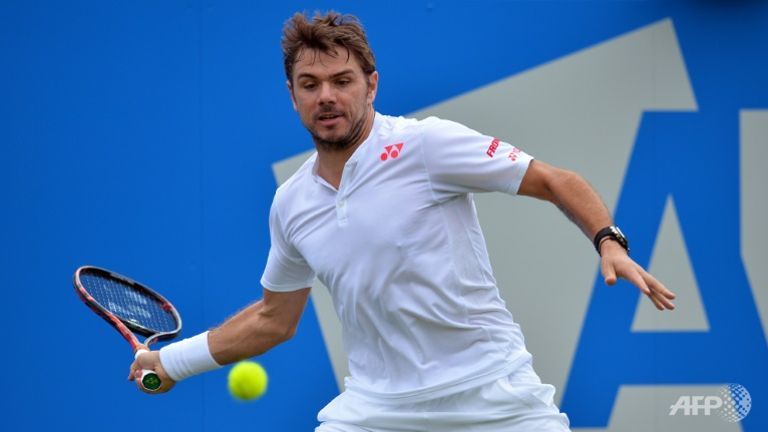 Stan Wawrinka returns to Fernando Verdasco at the ATP Aegon Championships tennis tournament at the Queen's Club in west London