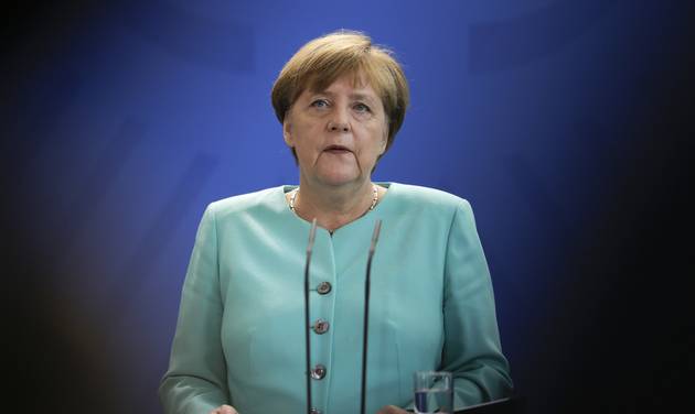 German Chancellor Angela Merkel speaks during a statement about the referendum in Britain at the chancellery in Berlin Friday