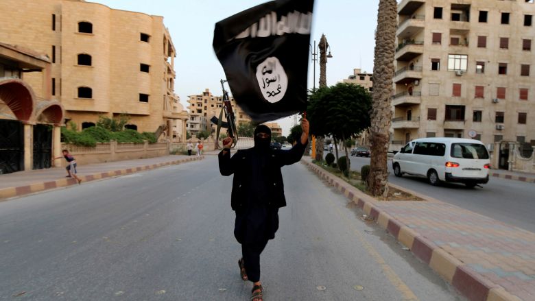 A member loyal to Daesh waves a flag in Raqqa. Daesh attacked Syrian army positions in Hama province on Monday in what appeared to be a retaliatory attack after the Syrian army advanced into the Daesh stronghold of Raqqa