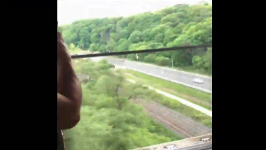 TTC train crosses Don Valley with door wide open