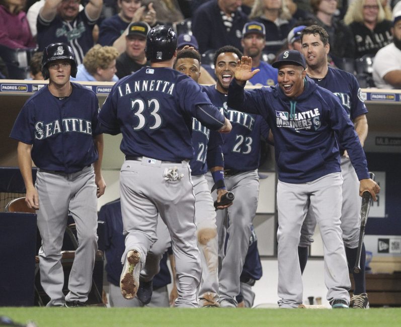 The Seattle Mariners&#x27 Chris Iannetta is congratulated by teammates after he scored on a single by Shawn O'Malley in the seventh inning against the San Diego Padres at Petco Park in San Diego on Thursday