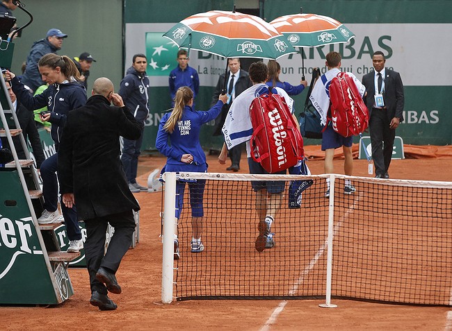 French Open loses day to rain as French great Guy Forget calls for Roland Garros to get with the times