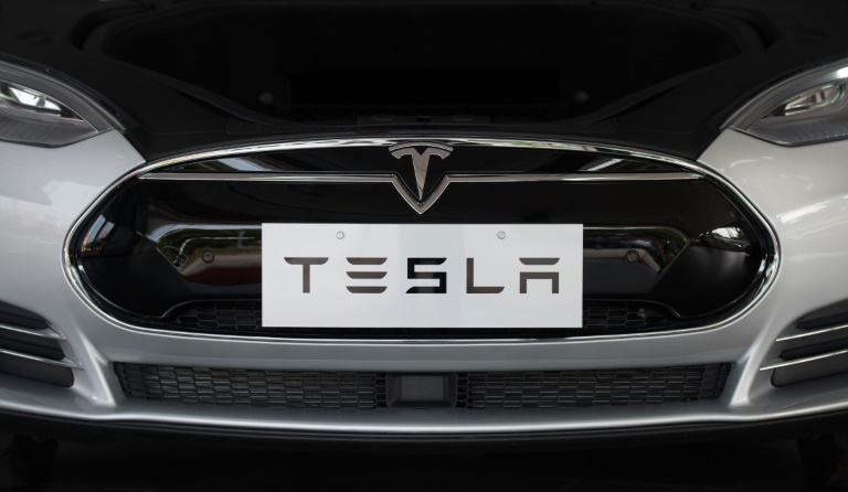 Tesla launches less costly versions of Model S, faces safety probe