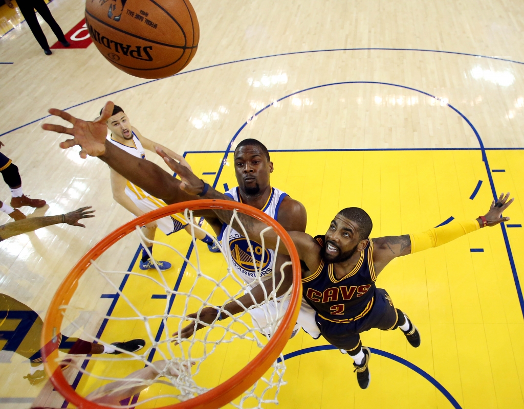 Jun 2 2016 Oakland CA USA Golden State Warriors forward Harrison Barnes shoots the ball against Cleveland Cavaliers guard Kyrie Irving during the first quarter in game one of the NBA Finals at Oracle Arena. Mandatory Credit Ezra Shaw Pool P