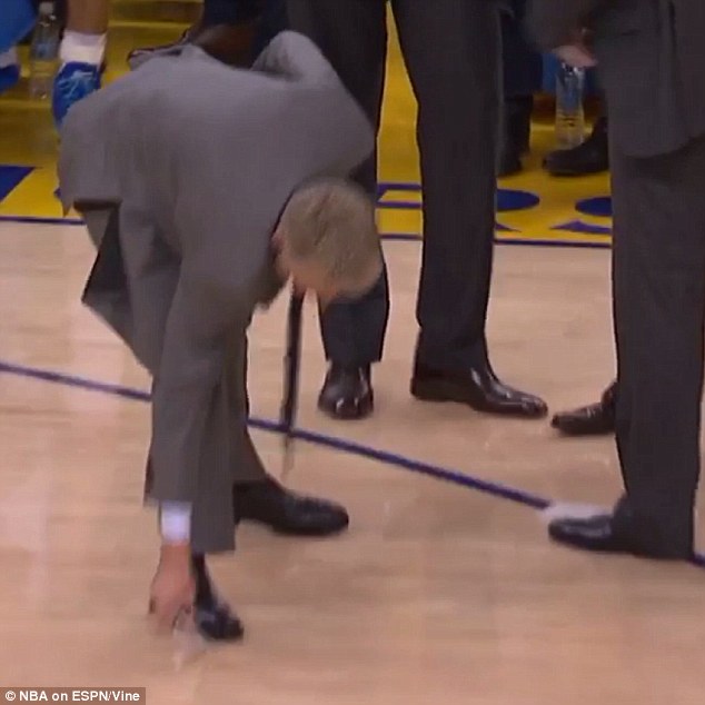 The furious Kerr then picked up the pieces of the board from the court as his team prepared to play