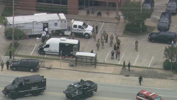 The scene at a Houston auto shop where gunfire erupted Sunday