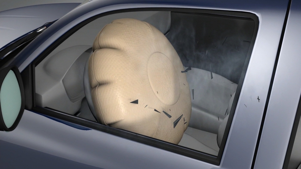 This graphic from the Insurance Institute for Highway Safety shows an airbag expanding shooting shrapnel toward the driver