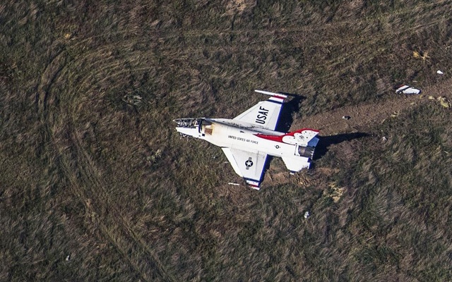 An Air Force F-16 with the Thunderbirds air demonstration squadron sits crashed in a field 4 miles south of Colorado Springs after performing a fly-by of the U.S. Air Force Academy graduation ceremony. Reuters