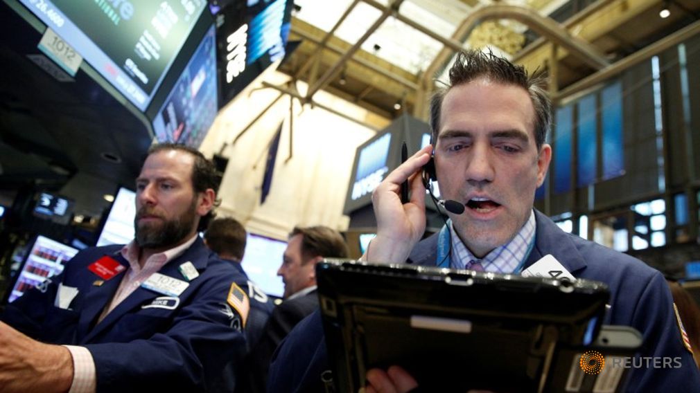 Traders work on the floor of the New York Stock Exchange in New York City U.S