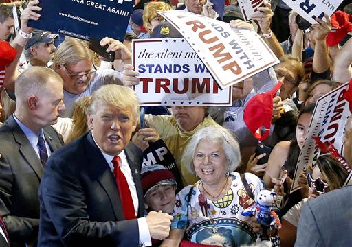 Republican presidential candidate Donald Trump left shouts to Secret Service agents that supporter Diana Brest right had been waiting in line since 2 a.m. to see the candidate speak at a rally Saturday