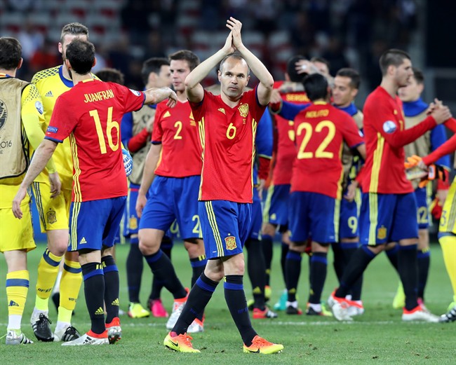 Spain's Andres Iniesta applauds to fans at the end of the Euro 2016 Group D soccer match between Spain and Turkey at the Allianz Riviera stadium in Nice France Friday