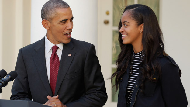 U.S. President Barack Obama delivers remarks with his daughter Malia