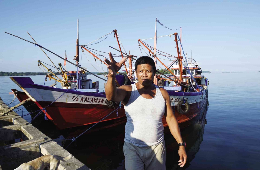 IDLED Epifanio Marqueza one of the captains of a reef-fishing fleet gestures next to his vessel idled in Masinloc Zambales province after an encounter with a Chinese Coast Guard ship at the nearby Panatag Shoal. AFP