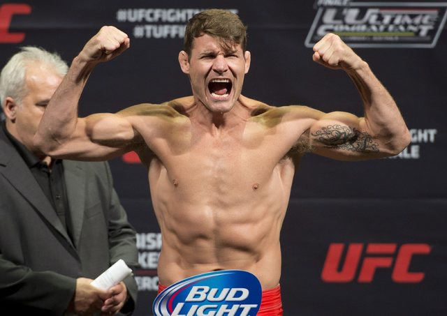 ASSOCIATED PRESS  THE CANADIAN PRESS APRIL 15 2014           Michael Bisping of England gestured during the weigh-in for a fight against Tim Kennedy of the United States in Quebec City Canada