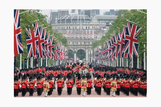 Britain's Queen Elizabeth II rides in a carriage along the Mall during the Trooping The Colour parade at Buckingham Palace in London Saturday