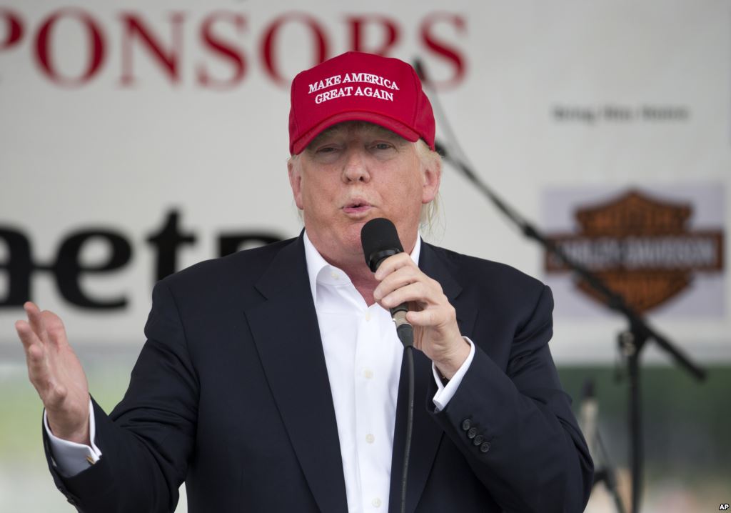 FILE- Republican presidential candidate Donald Trump speaks to supporters and bikers at a Rolling Thunder rally at the National Mall in Washington D.C