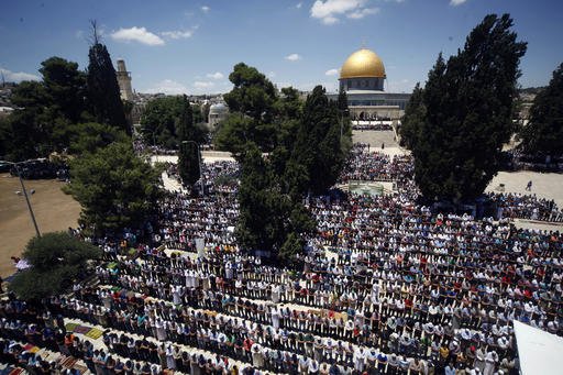 Palestinian men pray at the Al Aqsa Mosque compound during the Muslim holy month of Ramadan in Jerusalem's Old City Friday