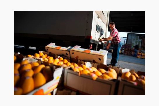 Michael Gipson of Tracy City Tenn. closes the door to his truck after loading up produce at the Atlanta Farmers Market in Atlanta. On Wednesday