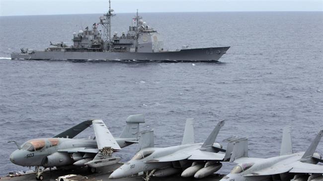 US fighter jets on standby at the upper deck of the USS George Washington aircraft carrier at the South China Sea