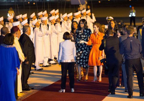 U.S. first lady Michelle Obama with her daughters Sasha and Malia is welcomed by Princess Lalla Salma of Morocco as she arrives at the Marrakech International Airport early