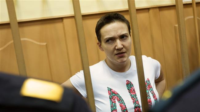 Ukrainian pilot Nadiya Savchenko seen inside the glass cage of a Russian courtroom