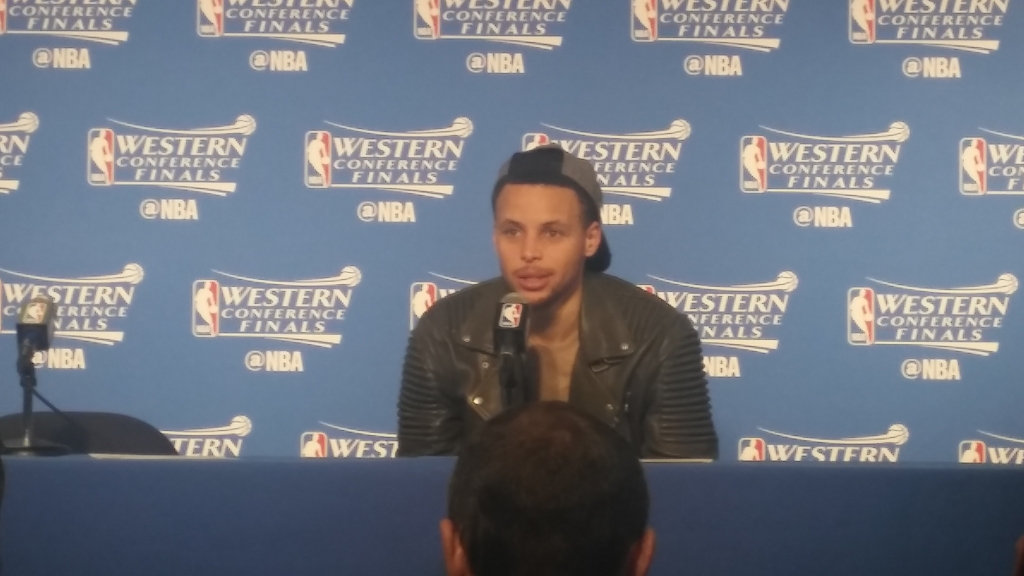 Steph Curry answers questions at the press conference following Game 7 of the Western Conference finals on Monday