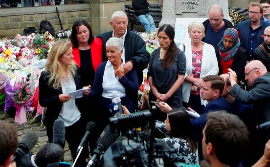 Kim Leadbeater, the sister of murdered Labour Party MP Jo Cox speaks as her parents Gordon and Jean Leadbeater listen in Birstall Britain