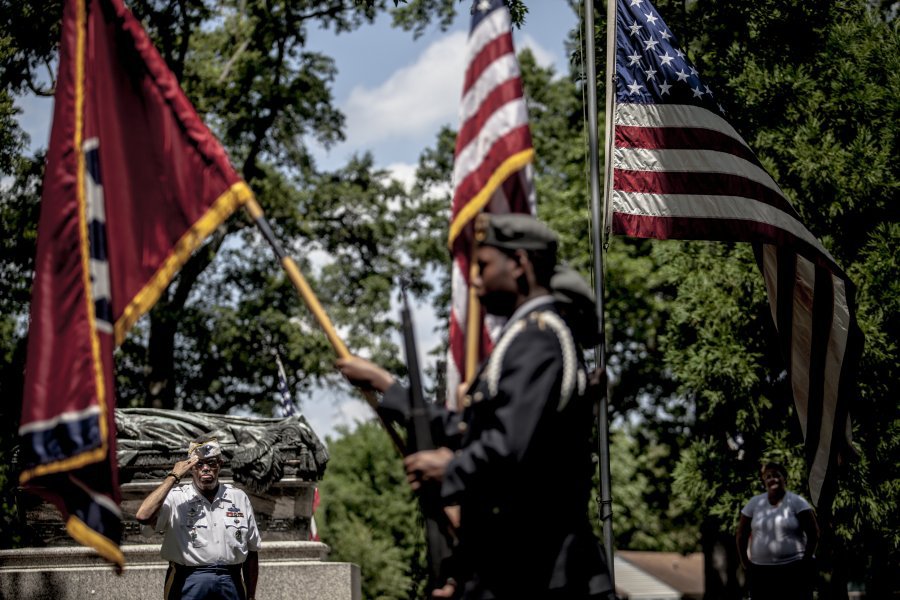 Richard Anderson salutes during the presentation of colors at the annual Memorial Day Ceremony at the Memphis National Cemetery Sunday. Anderson served in the Army and is now a part of VFW Post 11333. The program is sponsored by the Shelby County V