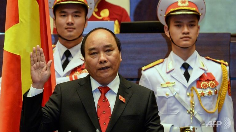 Vietnamese Prime Minister Nguyen Xuan Phuc is sworn into office during a ceremony in Hanoi on Apr 7 2016.
   
 

  Enlarge  Caption