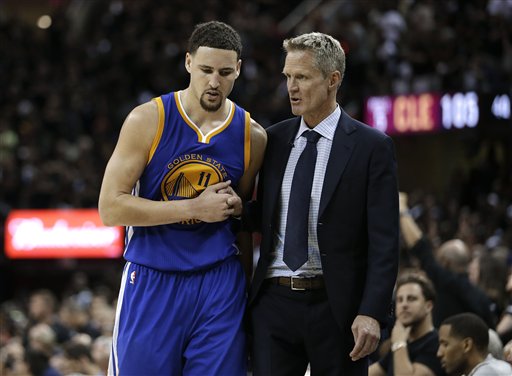 Golden State Warriors guard Klay Thompson talks with head coach Steve Kerr against the Cleveland Cavaliers during the second half of Game 6 of basketball's NBA Finals in Cleveland Thursday