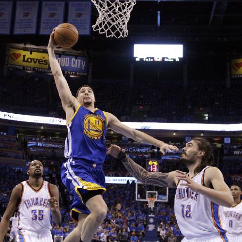 Warriors guard Klay Thompson shoots over Oklahoma City Thunder center Steven Adams during the second half in Game 6 of the NBA basketball Western Conference finals in Oklahoma City Saturday