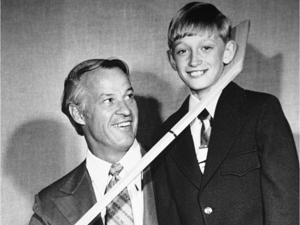 Wayne Gretzky is shown standing with hockey great Gordie Howe as a boy in Brantford Ont. in 1972