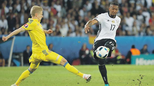 Germany’s Jerome Boateng clears the ball during Sunday’s Group C match against Ukraine