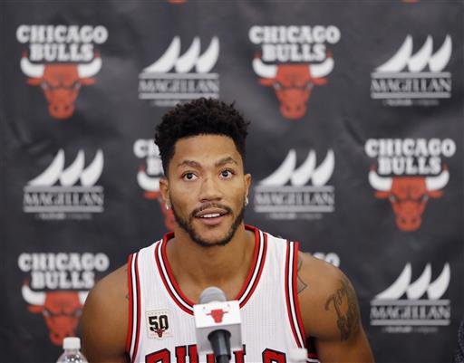 Chicago Bulls Derrick Rose sits down for an NBA basketball media day news conference in Chicago. Two people with knowledge of the deal say the New York Knicks are acquiring Rose from the Chicago Bulls. The Kni