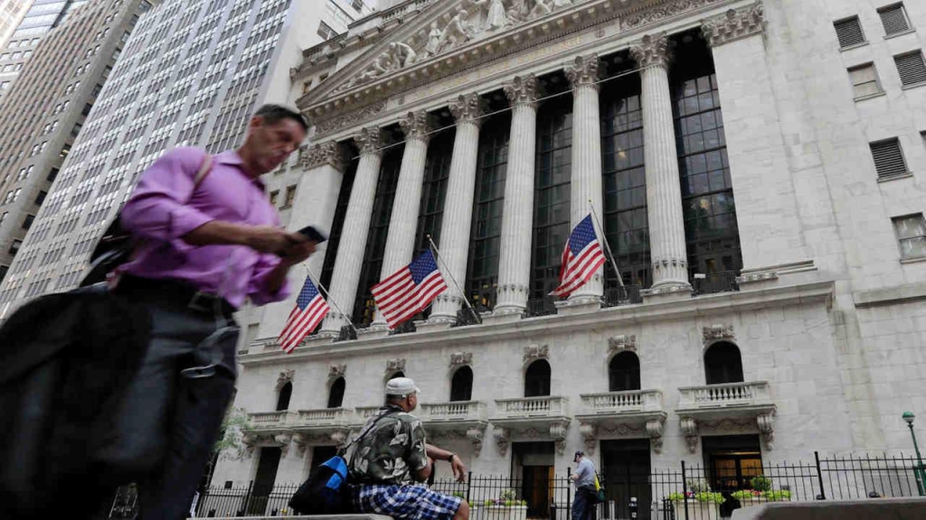 A man passes the New York Stock Exchange Friday. Britain voted to leave the European Union after a bitterly divisive referendum campaign sending global markets plunging