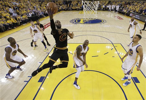 Cleveland Cavaliers forward Le Bron James shoots against the Golden State Warriors during the first half of Game 5 of basketball's NBA Finals in Oakland Calif. Monday