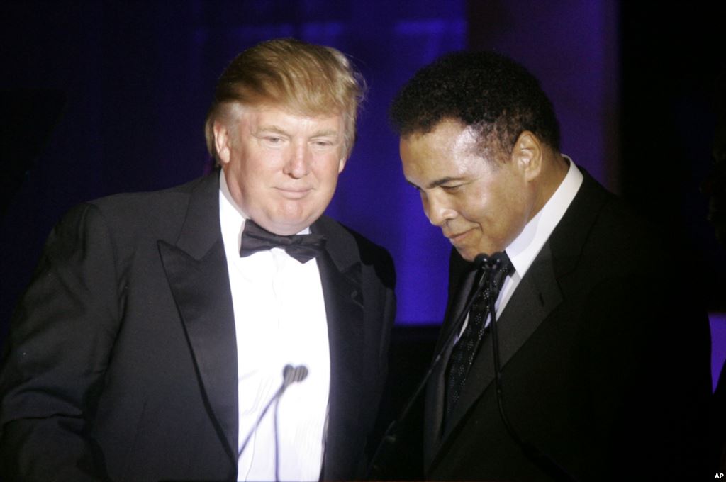 FILE- Donald Trump accepts his Muhammad Ali award from Ali at the boxing legend's'Celebrity Fight Night XIII in Phoenix Ariz