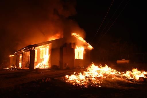 A home is fully engulfed in a fire