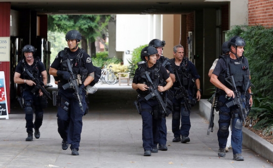 Police officers conduct a search at the University of California Los Angeles campus after it was placed on lockdown on June 1