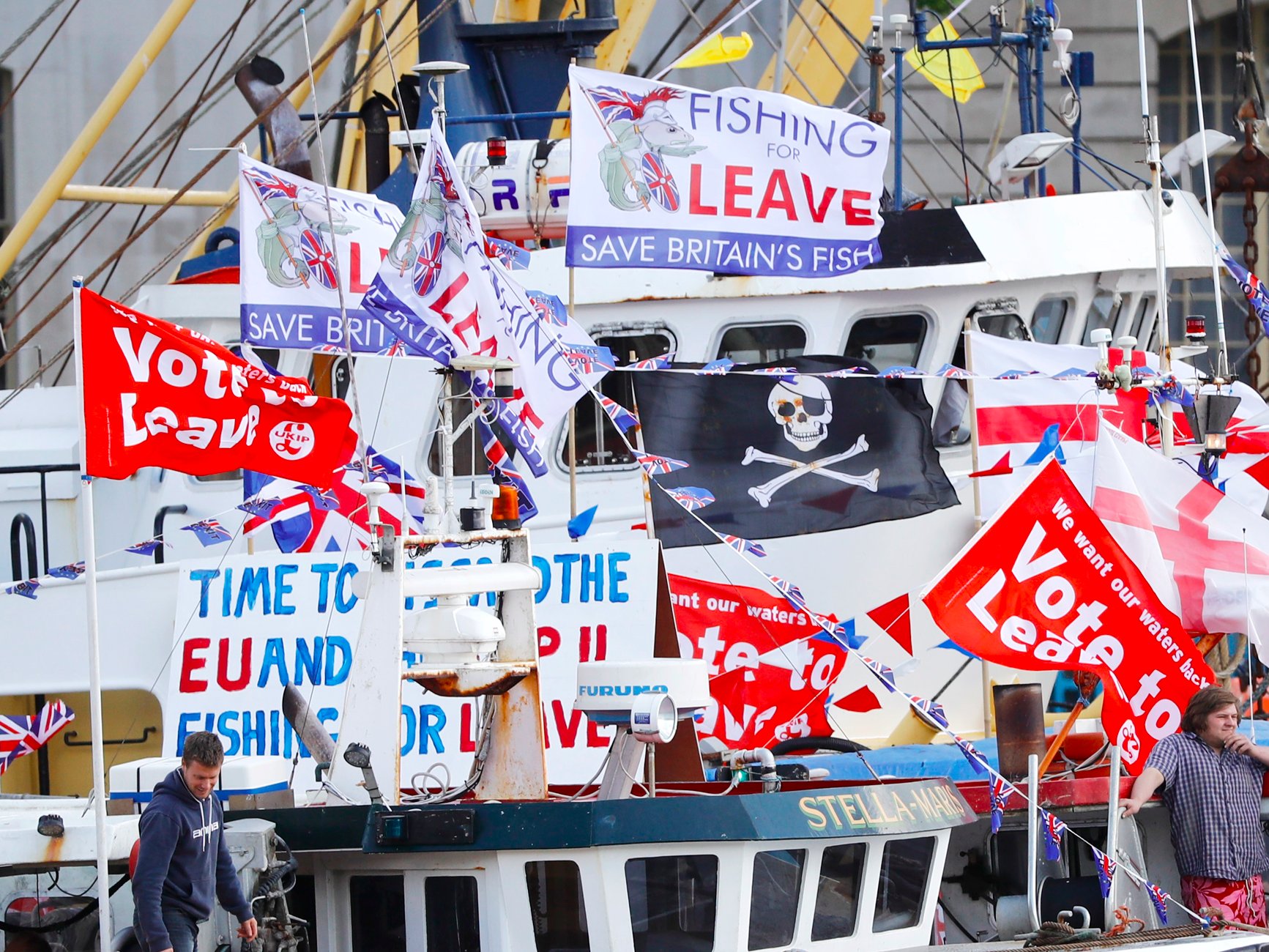 A flotilla of fishing vessels campaigning to leave the European Union sails up the river Thames in London Britain