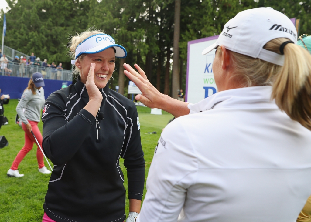 SAMMAMISH WA- JUNE 08  Brooke Henderson of Canada is greeted by Stacy Lewis after a shot during the LPGA Tour Player Showcase prior to the start of the KPMG Women's PGA Championship at the Sahalee Country Club