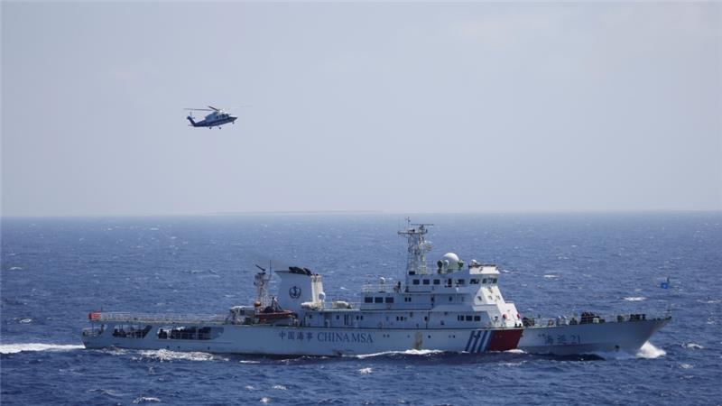 A Chinese ship and helicopter are seen during a search-and-rescue exercise in the South China Sea